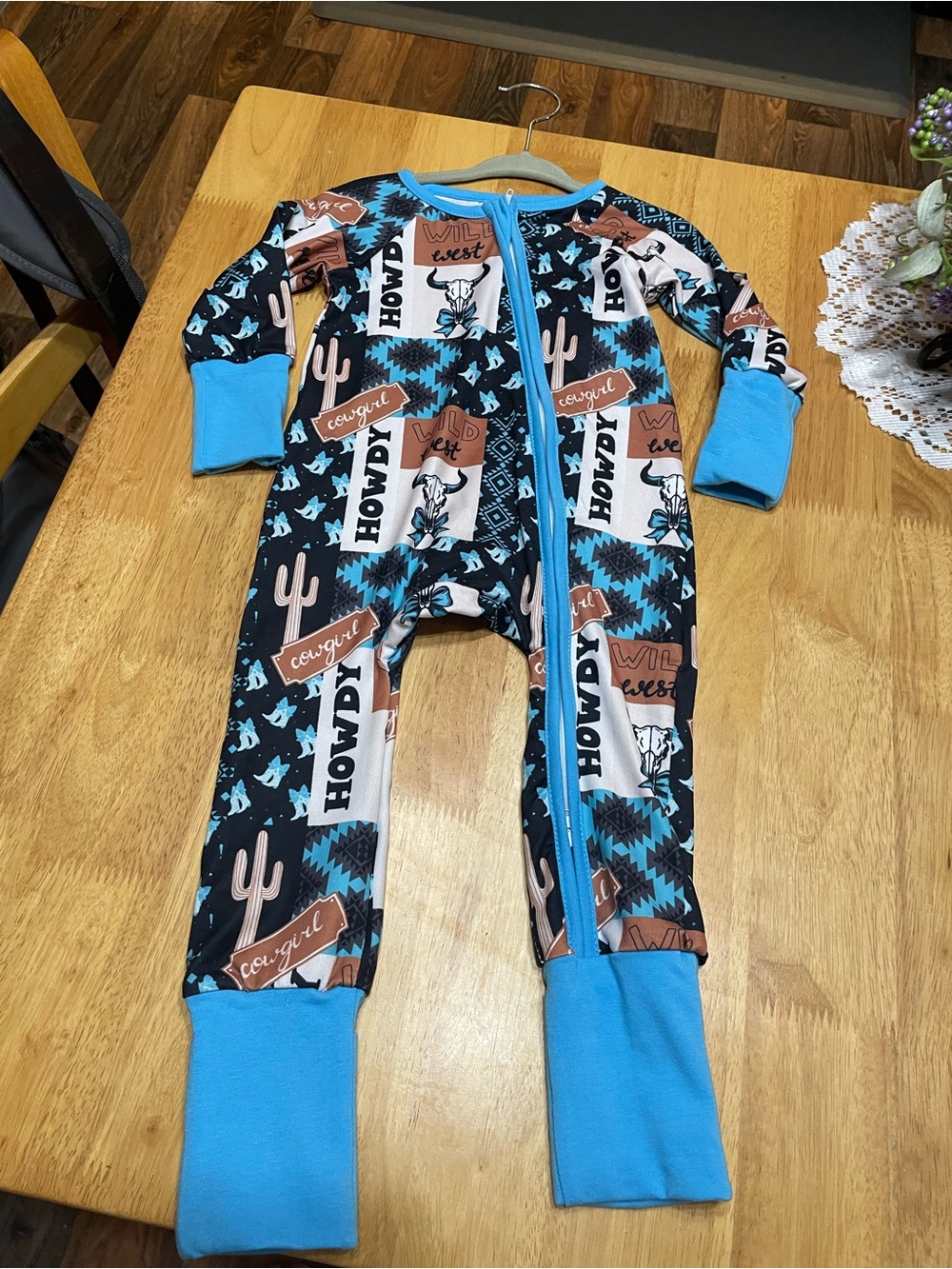 Kids One-Piece Zipper Romper in Black & Aqua Cowboy Print